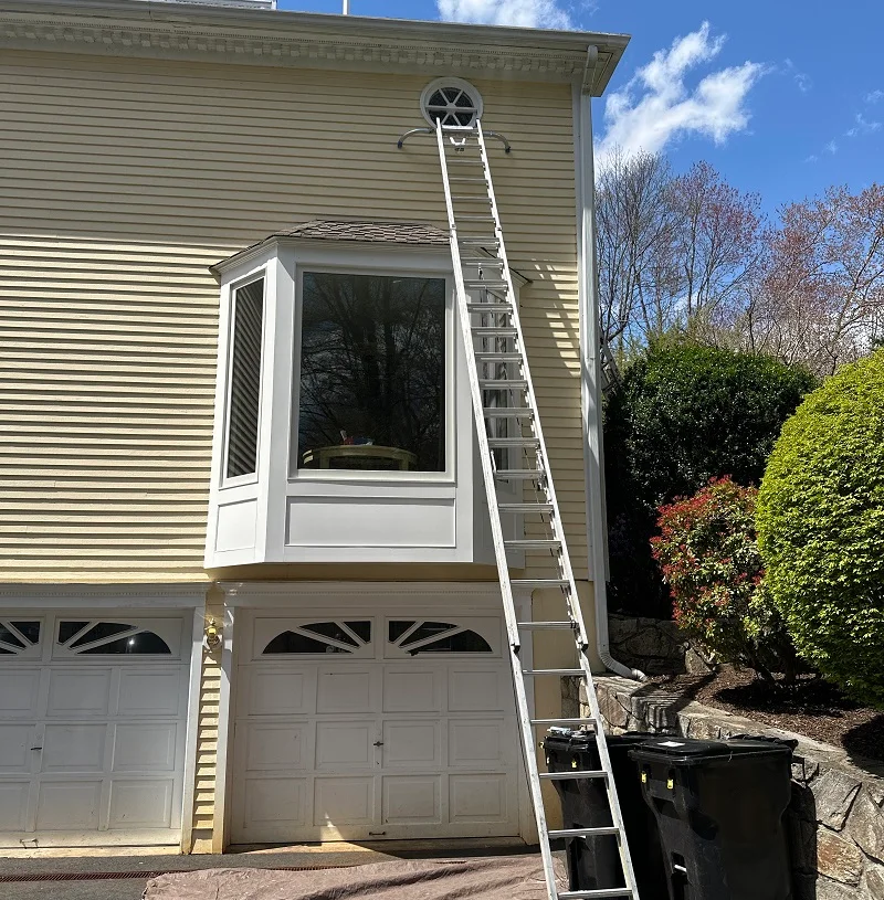 Preparing to remove this circle window in New Canaan, CT